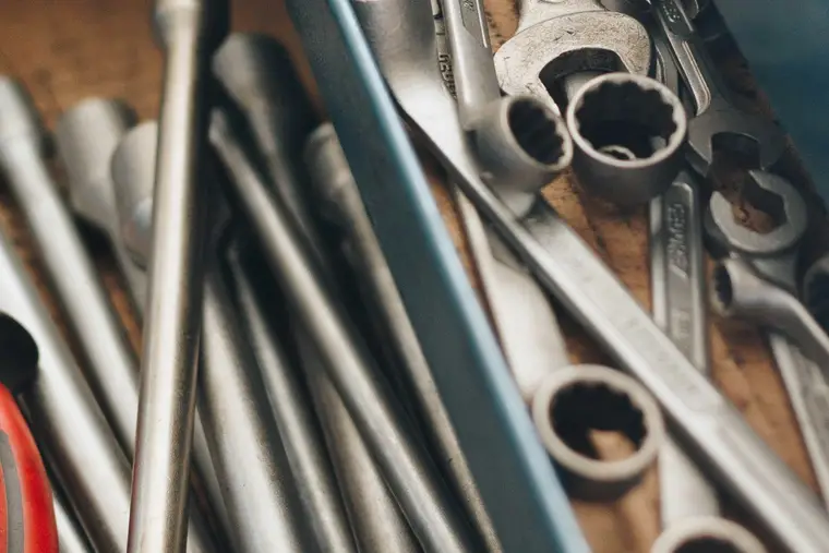 Combination spanners in a wooden tray